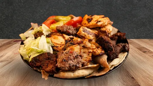 A generous plate of doner kebab, chicken shish and lamb kofta. Served with fresh salad and sauce. — delivery in Northampton