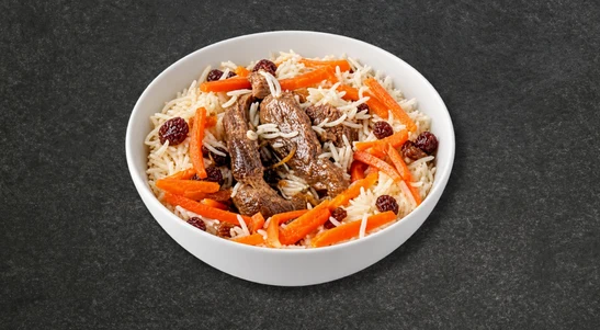 Afghan style pulao with beef shin topped with raisins, nuts & carrots. — delivery in Seafield PO12