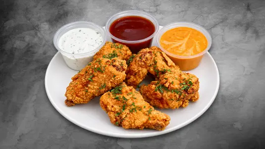 Six wings, encrusted in our seasoned flour blend before being prepared using our triple-fry process for a crisp golden finish
