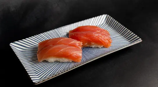 Silky tuna placed over hand-pressed sushi rice for a clean & balanced bite. — delivery in Milton Keynes