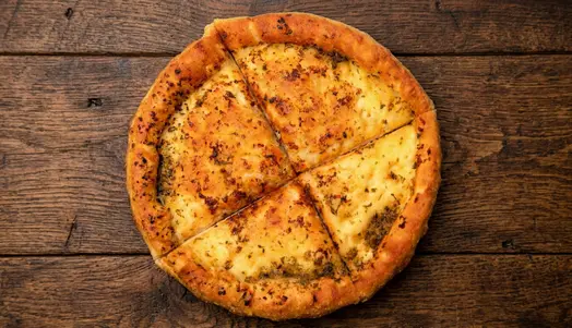 A 7" pan made pizza bread with a garlic sauce base — delivery in Honor Oak SE23